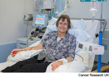 A patient undergoing apheresis to collect T cells